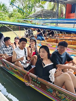 Call a minivan to Damnoen Saduak Floating Market.